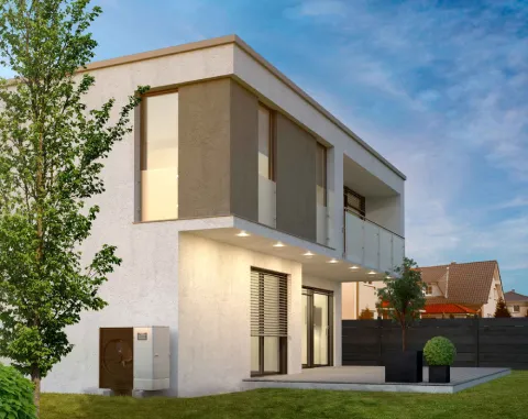 Unité extérieure de pompe à chaleur Mitsubishi Electric devant une maison d'architecte